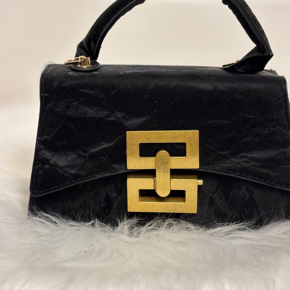 Elegant Black Handbag with Gold Accent